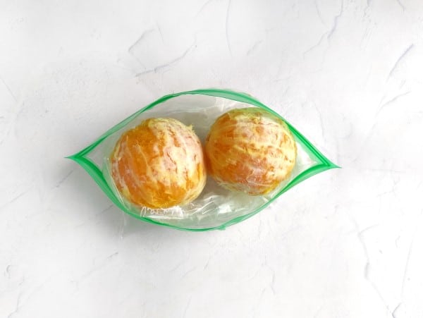 shaved ice recipe - two peeled oranges in ziploc bag