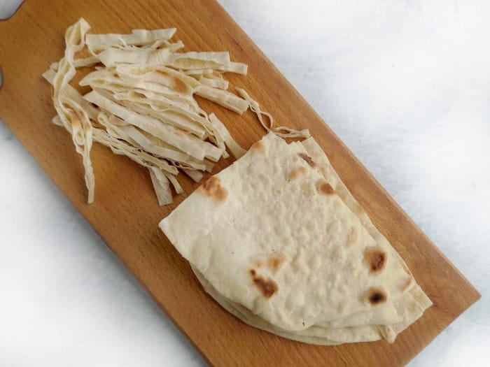 chicken tortilla soup - cutting board with tortilla strips