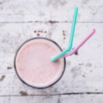 pink smoothie with straws