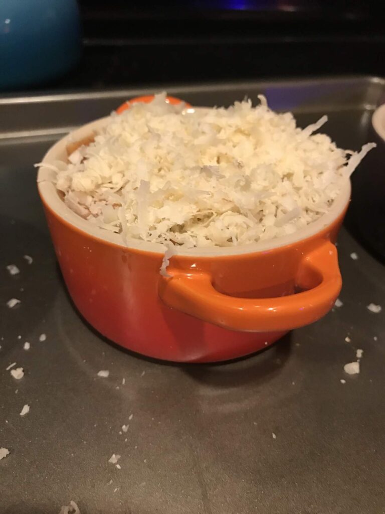 tomato soup with grated cheese on top