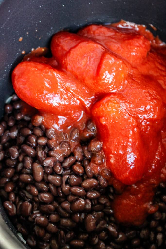 black bean cumin soup - beans and tomatoes added