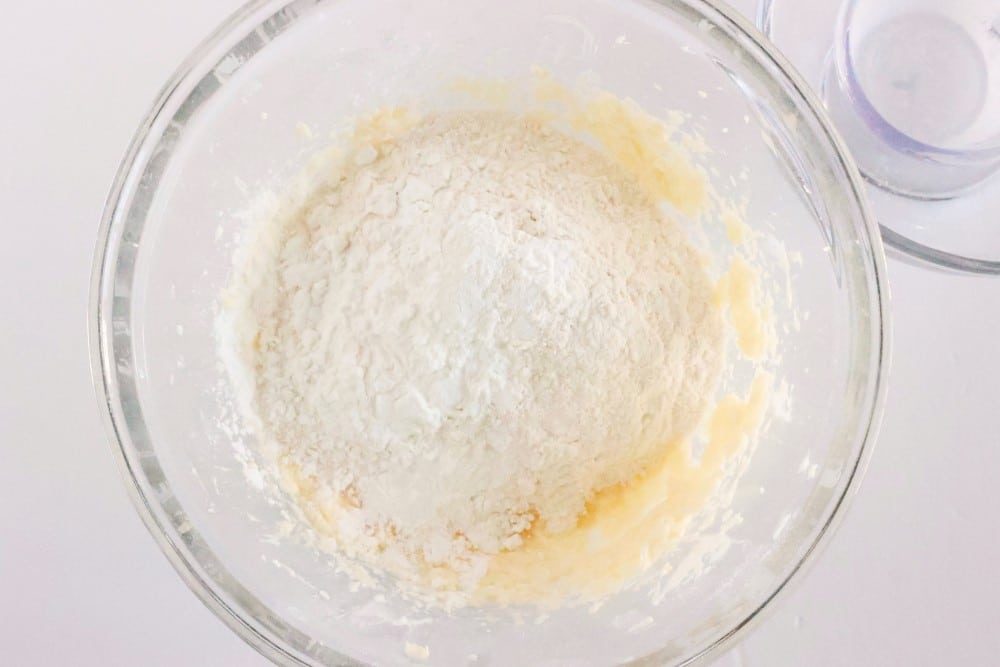 heart thumbprint cookies: dough in bowl, flour added