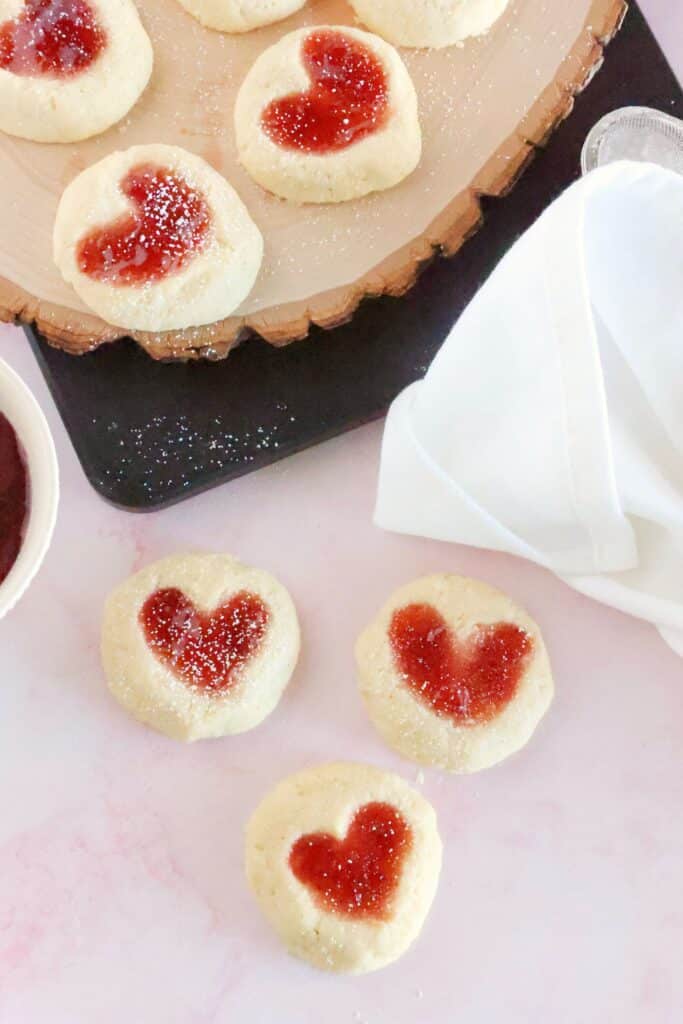heart thumbprint cookies finished with powdered sugar dusted on top