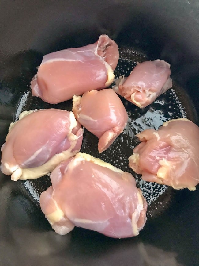 Lemon Basil Chicken Thighs - six chicken thighs in slow cooker